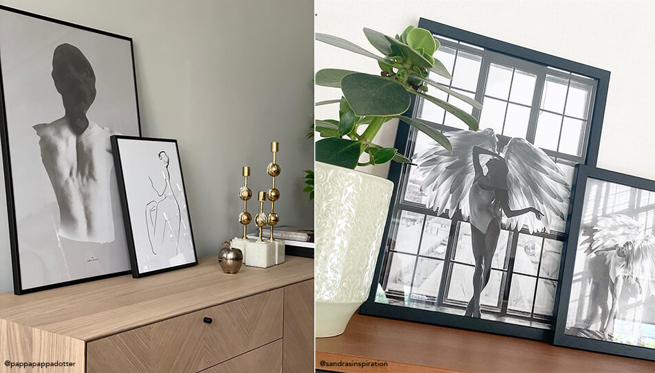 Juodai baltos nuotraukos pastatyti ant komodos